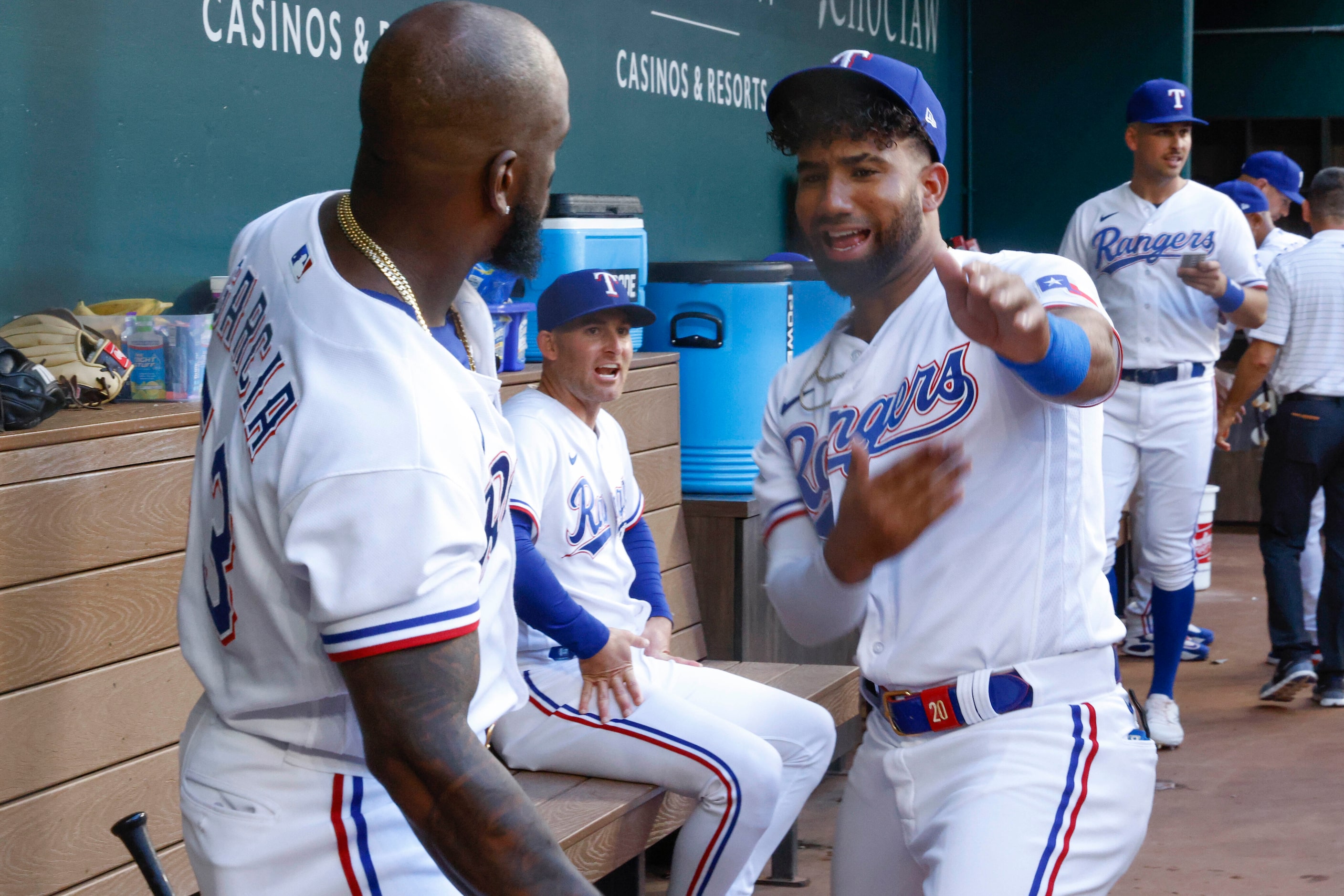 Texas Rangers right fielder Adolis Garcia (left) and Texas Rangers third baseman Ezequiel...