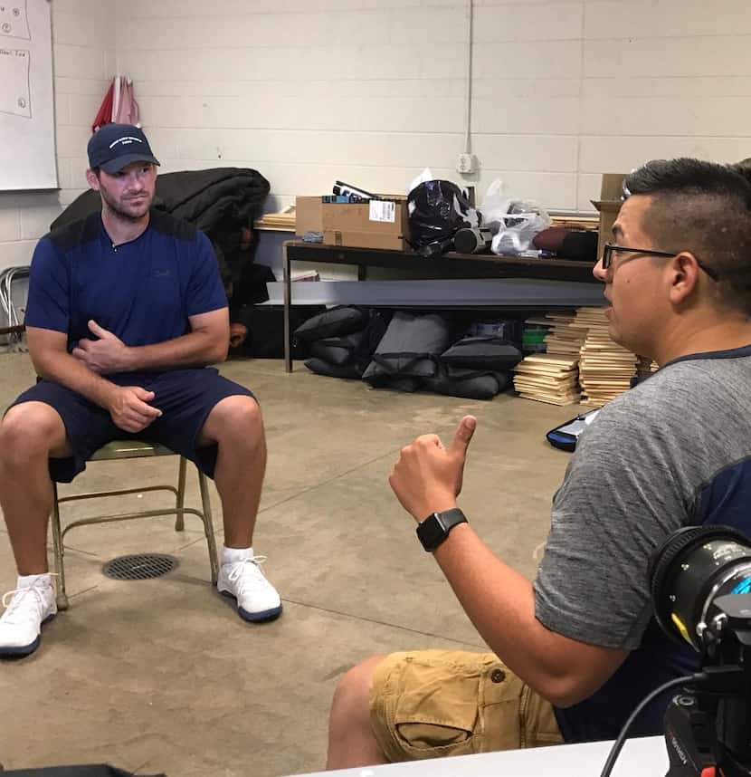 Producer-director Chris Hanna (right) interviews former Dallas Cowboys quarterback Tony Romo...