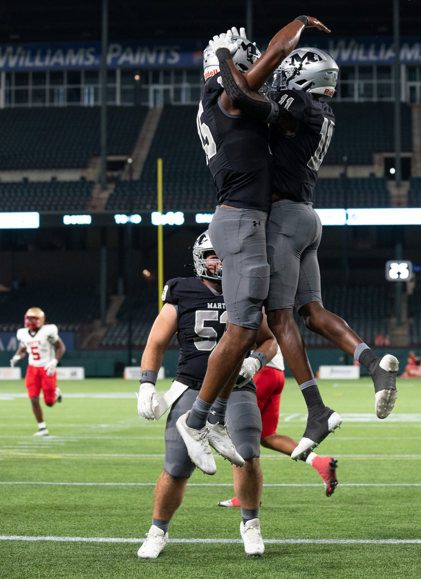 Arlington Martin senior wide receivers Ismael Smith Flores (15), left, and Jeremiah Charles...