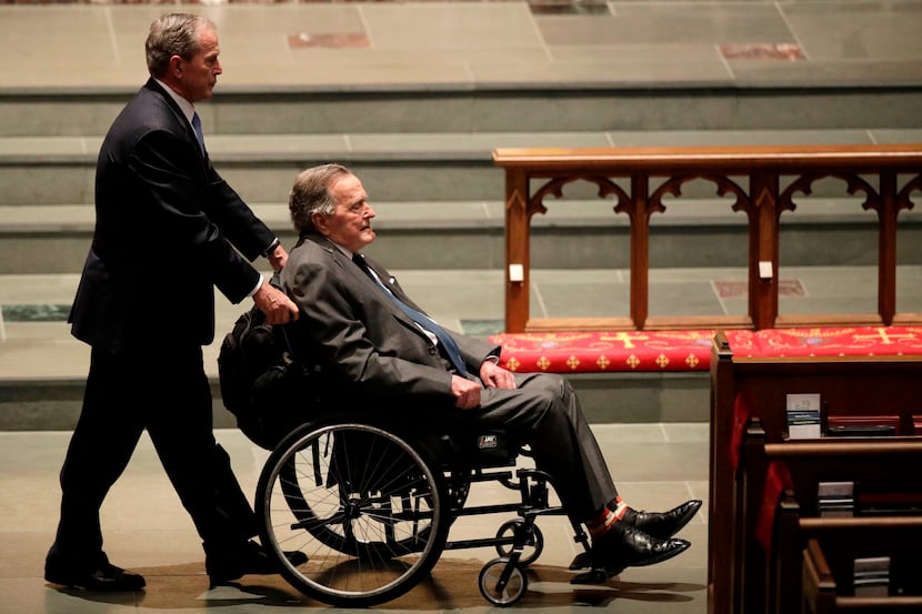 Former presidents George W. Bush and George H.W. Bush arrive at St. Martin's Episcopal...