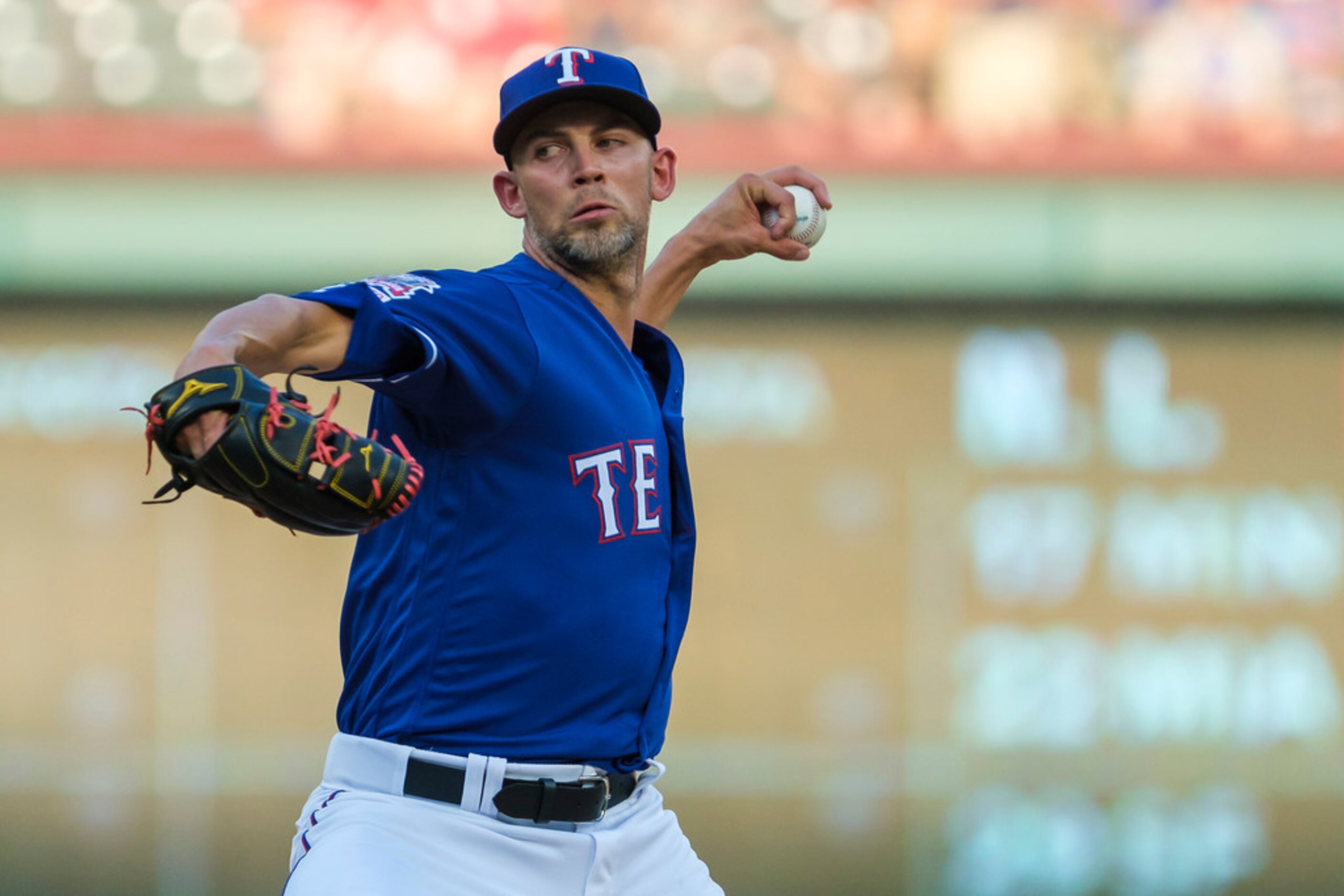 Texas Rangers starting pitcher Mike Minor delivers during the first inning against the...