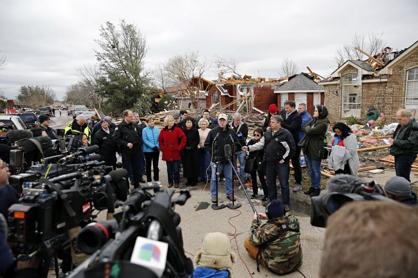 Mayor Douglas Athas (center) addressed the media in 2015 after a powerful tornado killed...