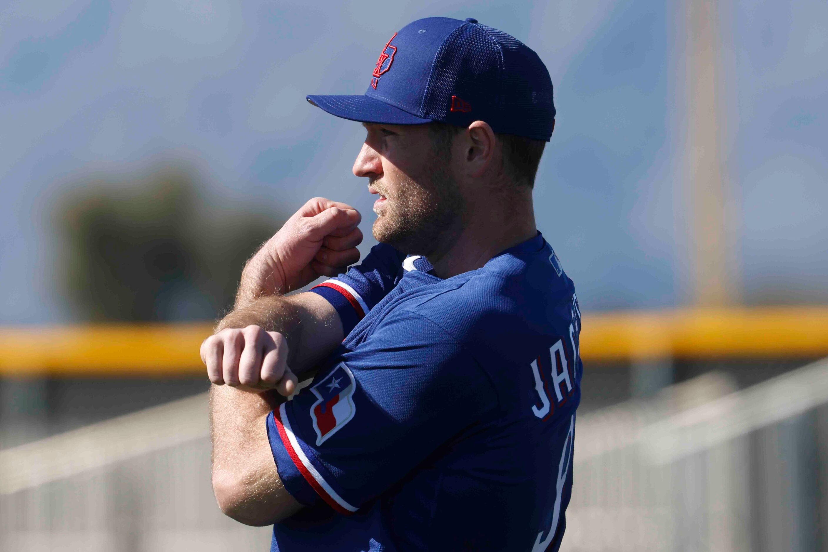 Texas Rangers left handed pitcher Lucas Jacobsen warms up during the first spring training...