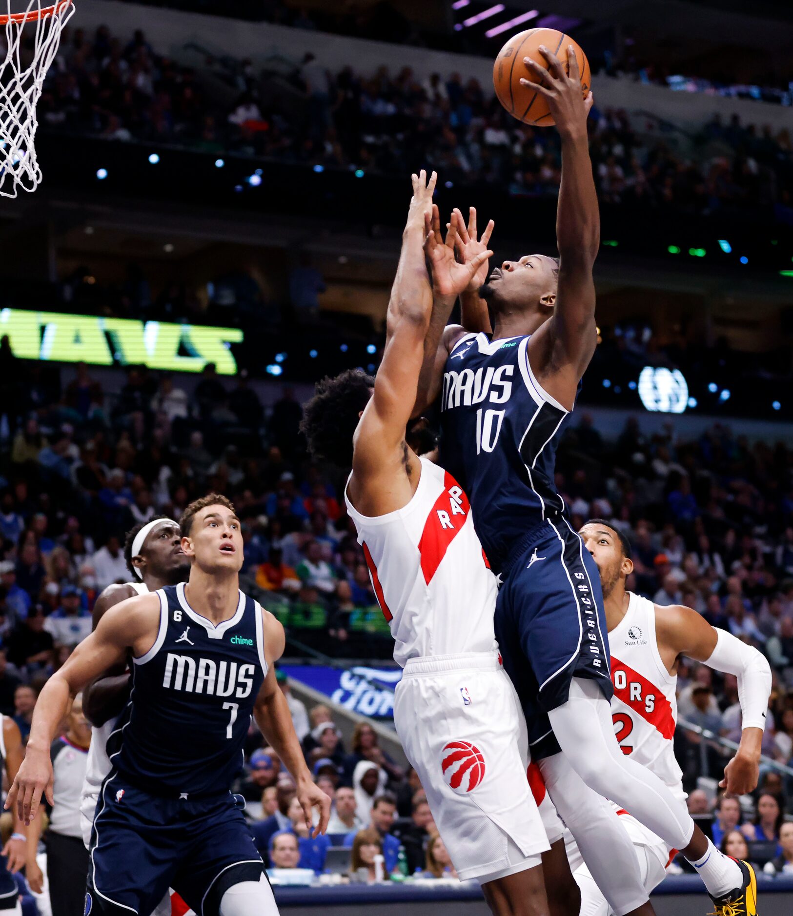 Dallas Mavericks forward Dorian Finney-Smith (10) goes up for a shot against the Toronto...