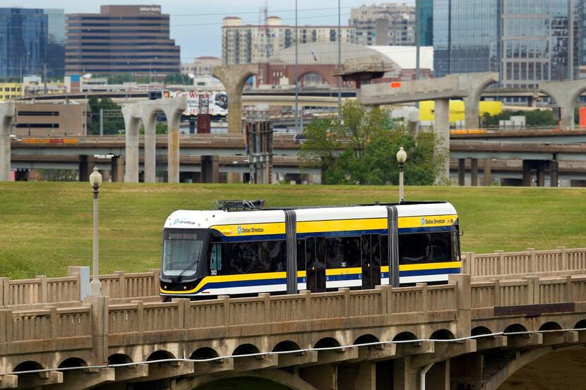 
The streetcar is powered by two 550-volt batteries as it crosses the Trinity River on the...