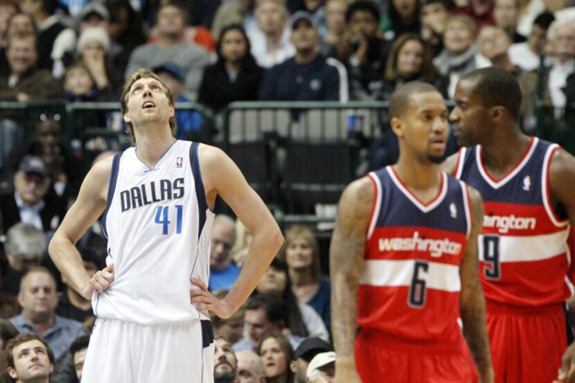 Dallas Mavericks power forward Dirk Nowitzki (41) watches the replay of his shot that moved...