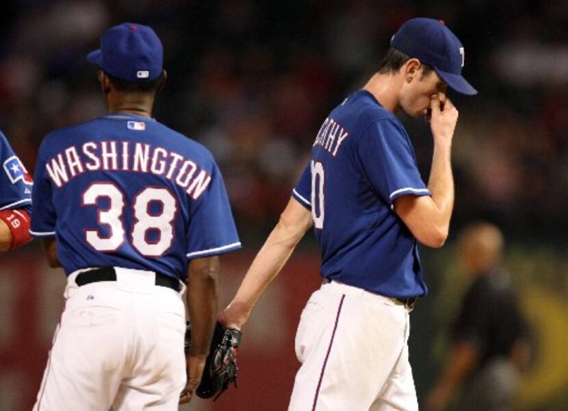 Texas Rangers' Brandon McCarthy (20) walks to the dugout after manager Ron Washington pulls...