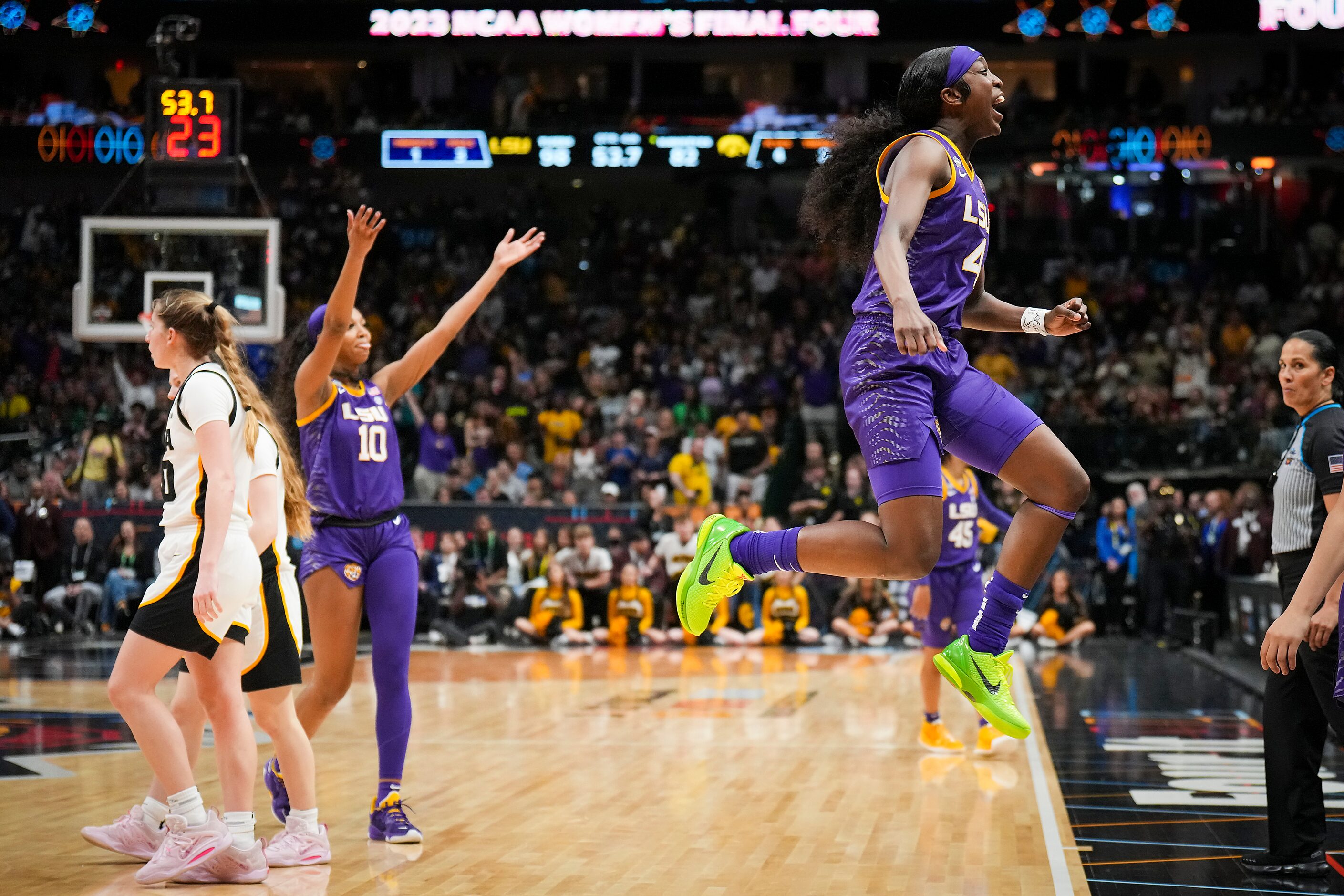 LSU guard Flau'jae Johnson (4) and forward Angel Reese (10) celebrate during the second half...