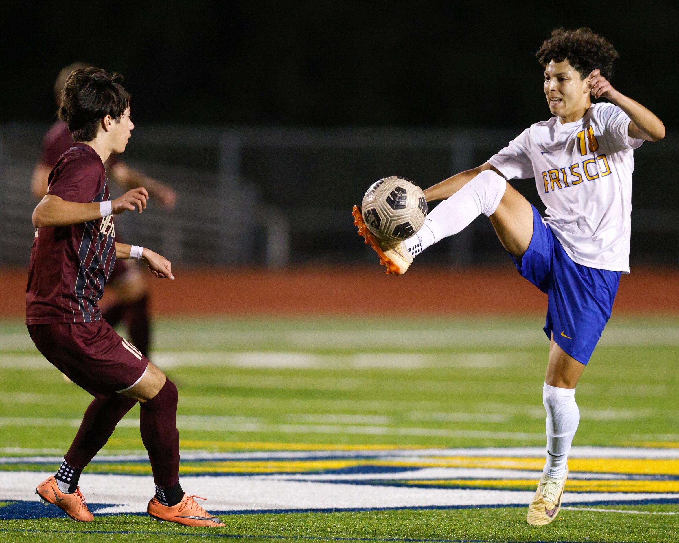 Frisco’s Jason Matehuala (18) plays the ball ahead of Frisco Heritage forward Jorge Torres...