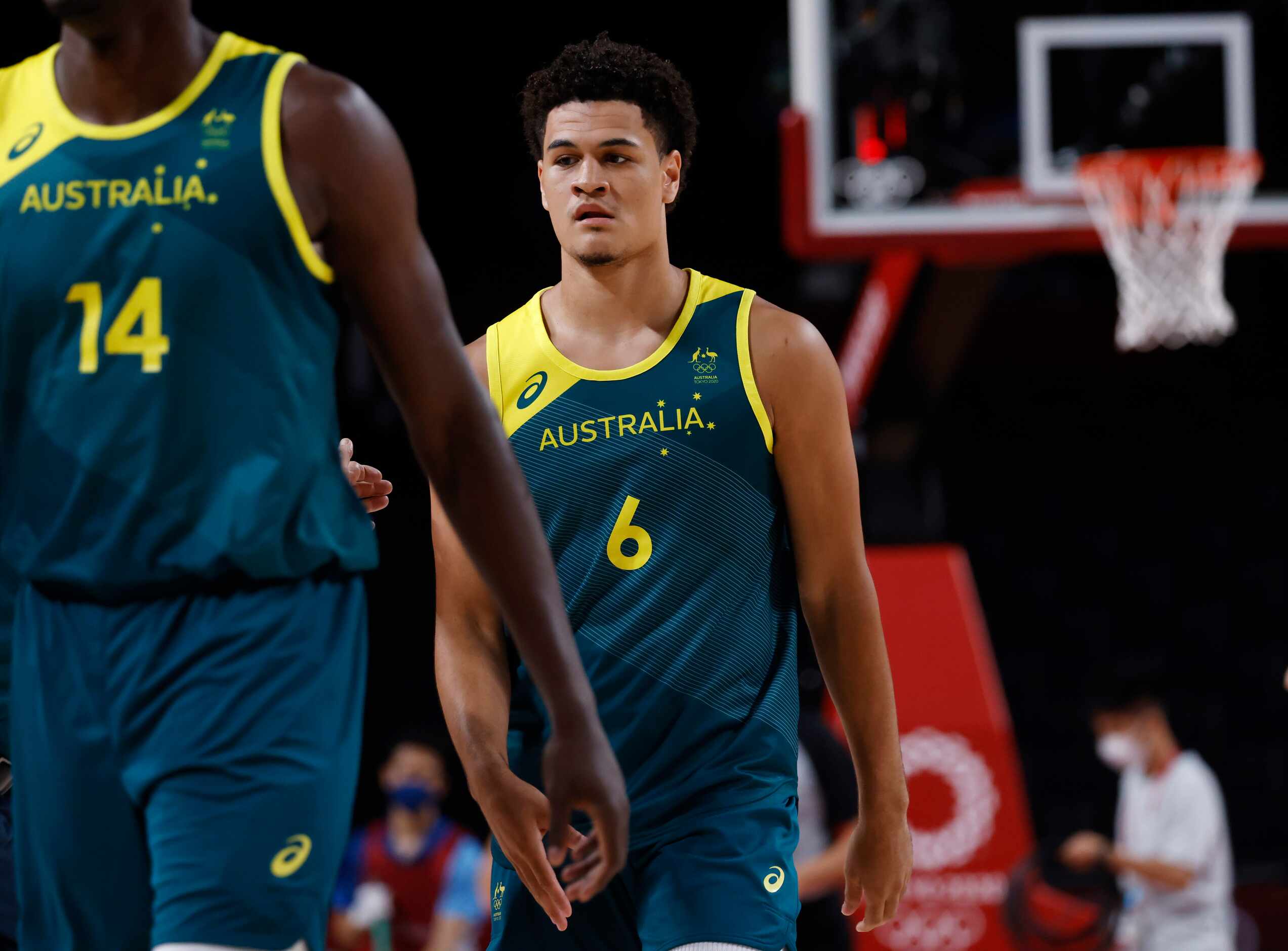 Australia’s Josh Green makes his way to the bench during a timeout in a game against USA...