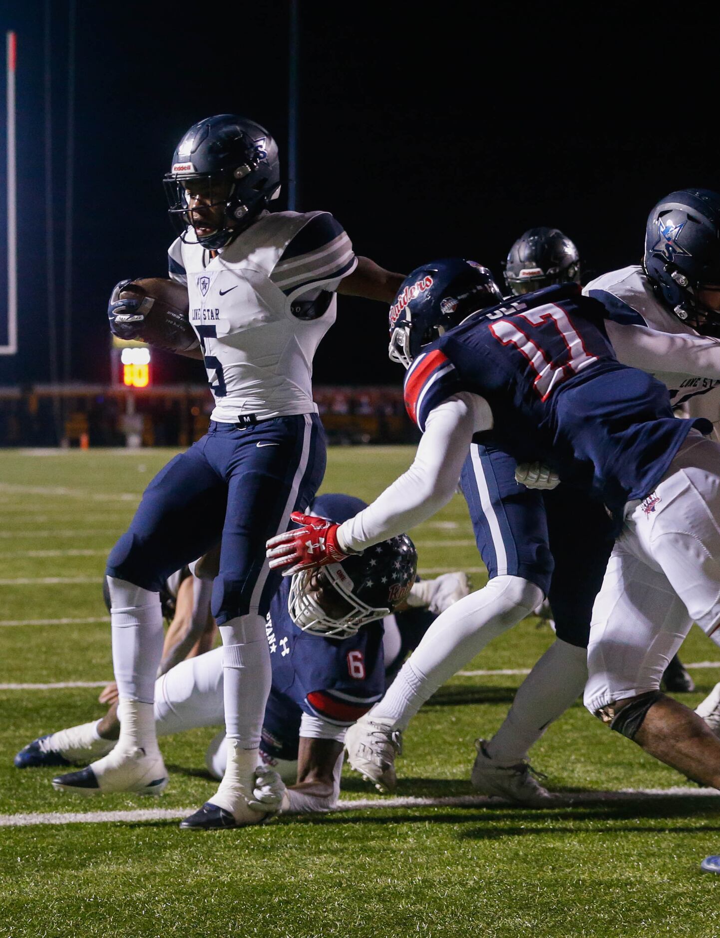 Frisco Lone Star's running back Jaden Nixon (5) scores a touchdown during the end of the...