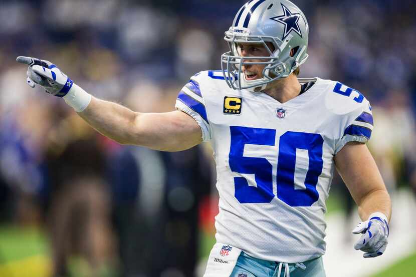 Dallas Cowboys outside linebacker Sean Lee (50) points to a fan as he warms up before an NFL...