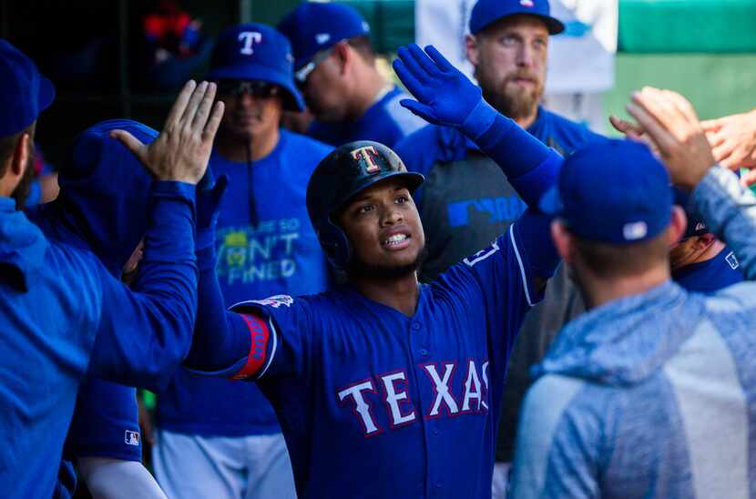 Texas Rangers left fielder Willie Calhoun (5) celebrates a home run during the seventh...