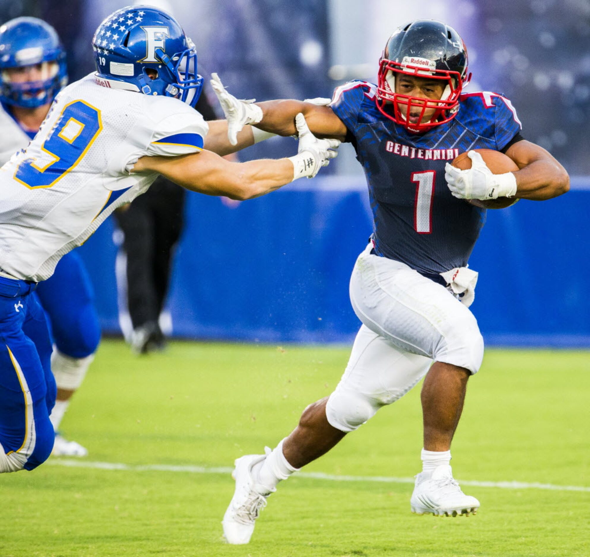 Frisco Centennial tailback Xavier Johnson (1) keeps Frisco defensive back Christian Green...