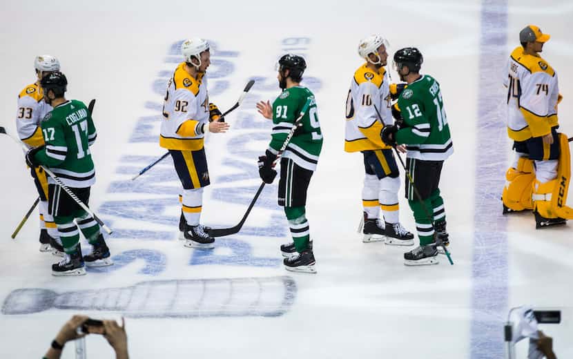 Dallas Stars and Nashville Predators players shake hands after Game 6 of the first round of...