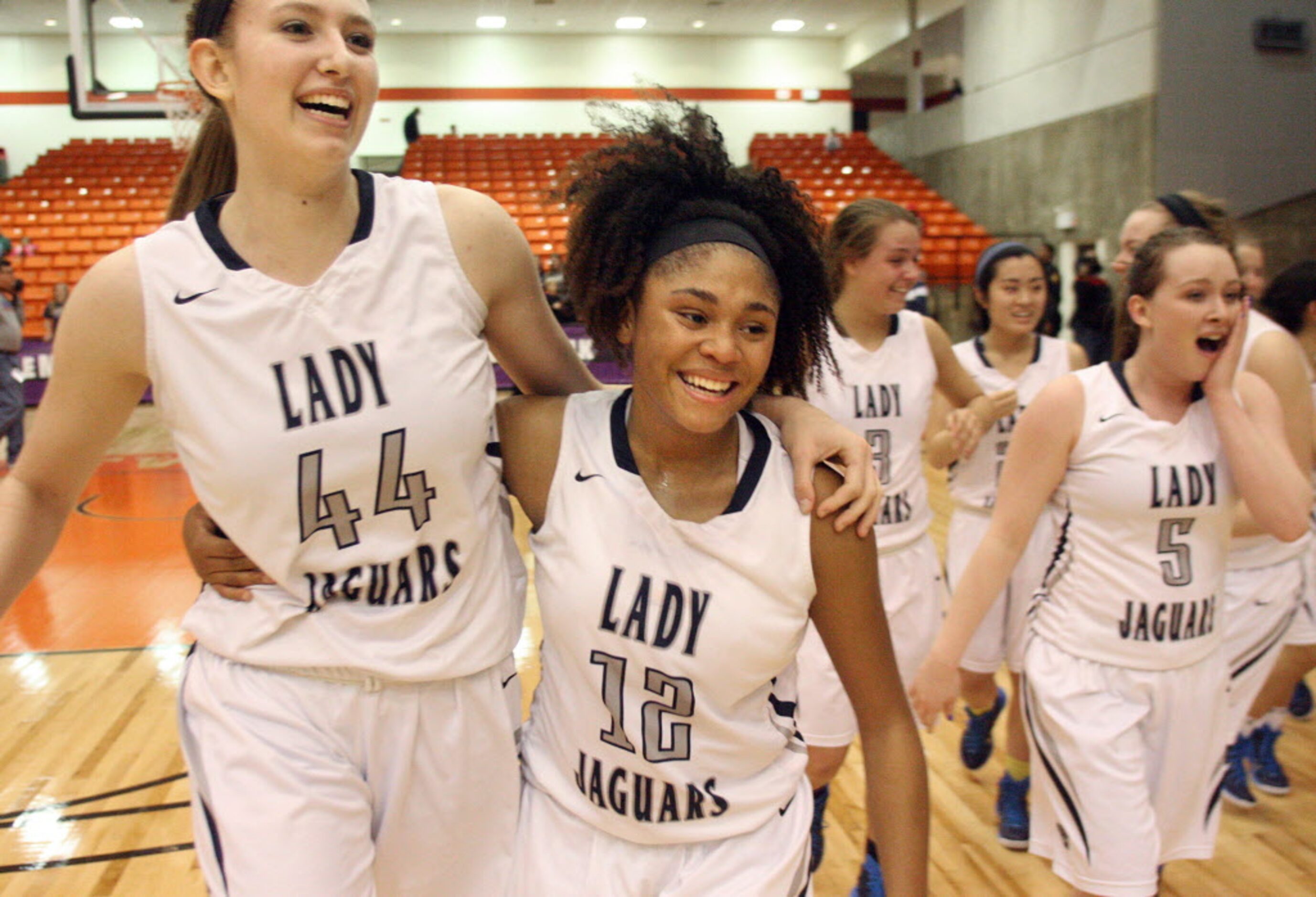 Flower Mound High School junior Lauren Cox (44), senior Courtney Fields (12) and senior...