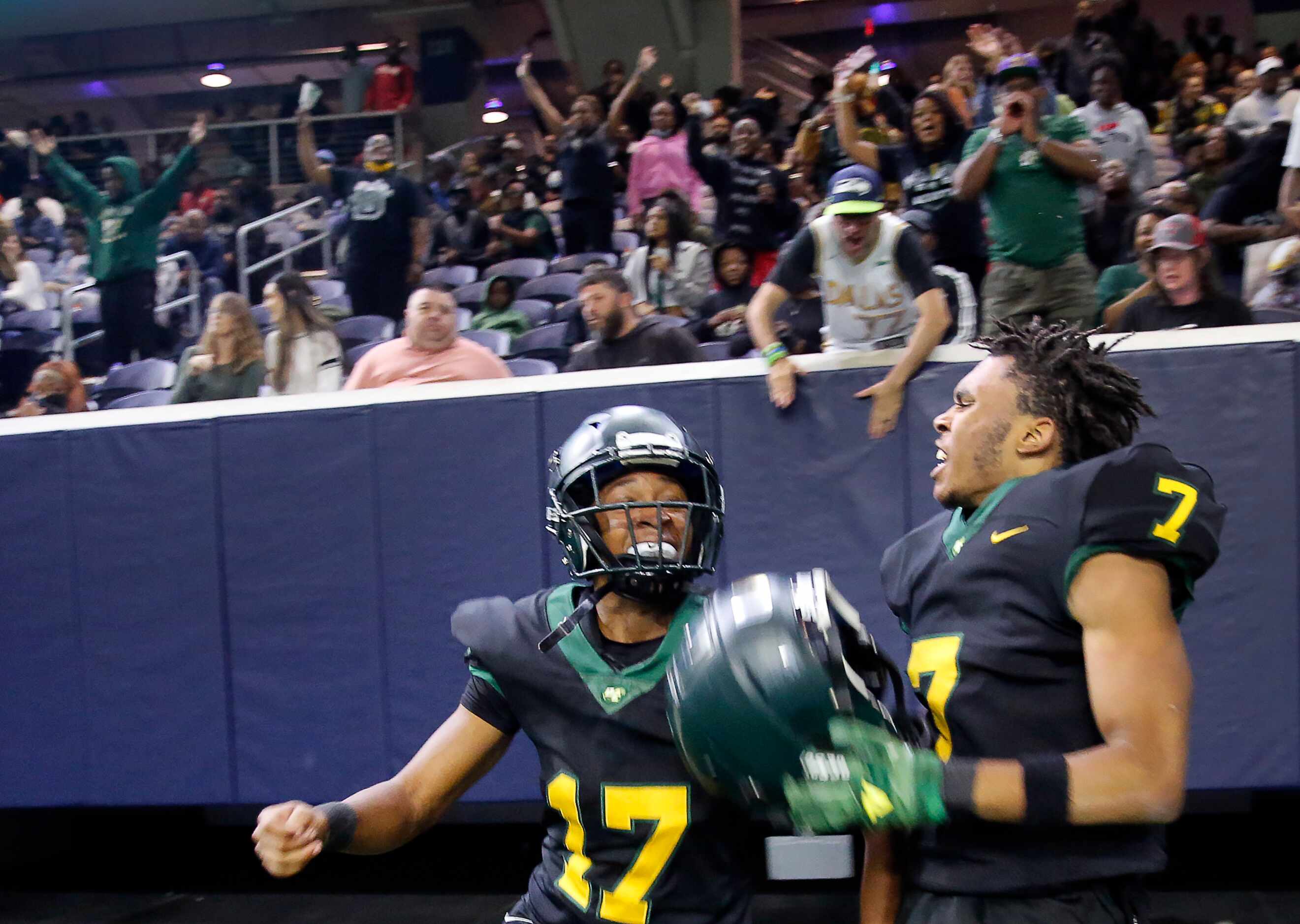 DeSoto free safety Jeshan McCoy (17) and fans cheer Jamarion Ravenell’s (7) fumble recovery...