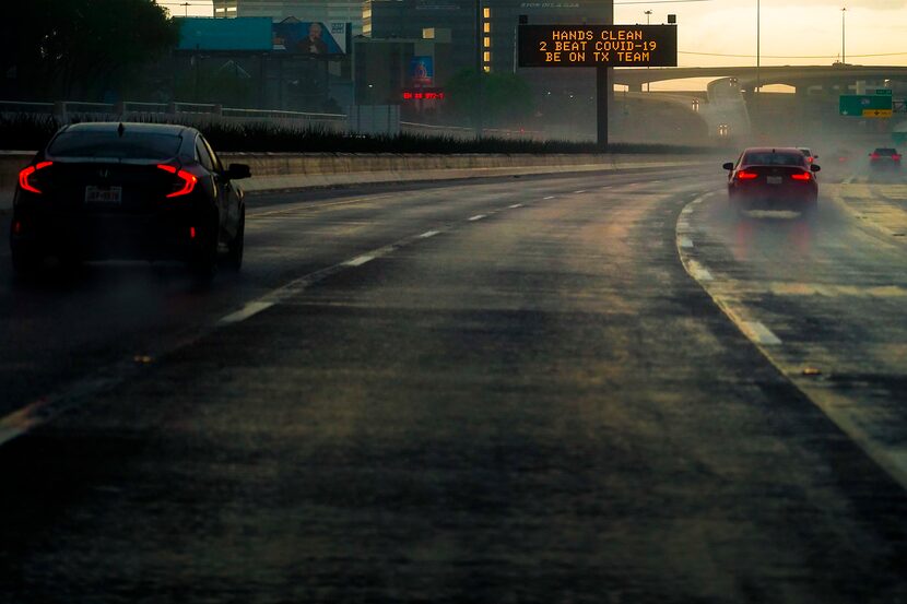 A traffic sign gave advice on hand-washing to combat COVID-19 as traffic headed north on...