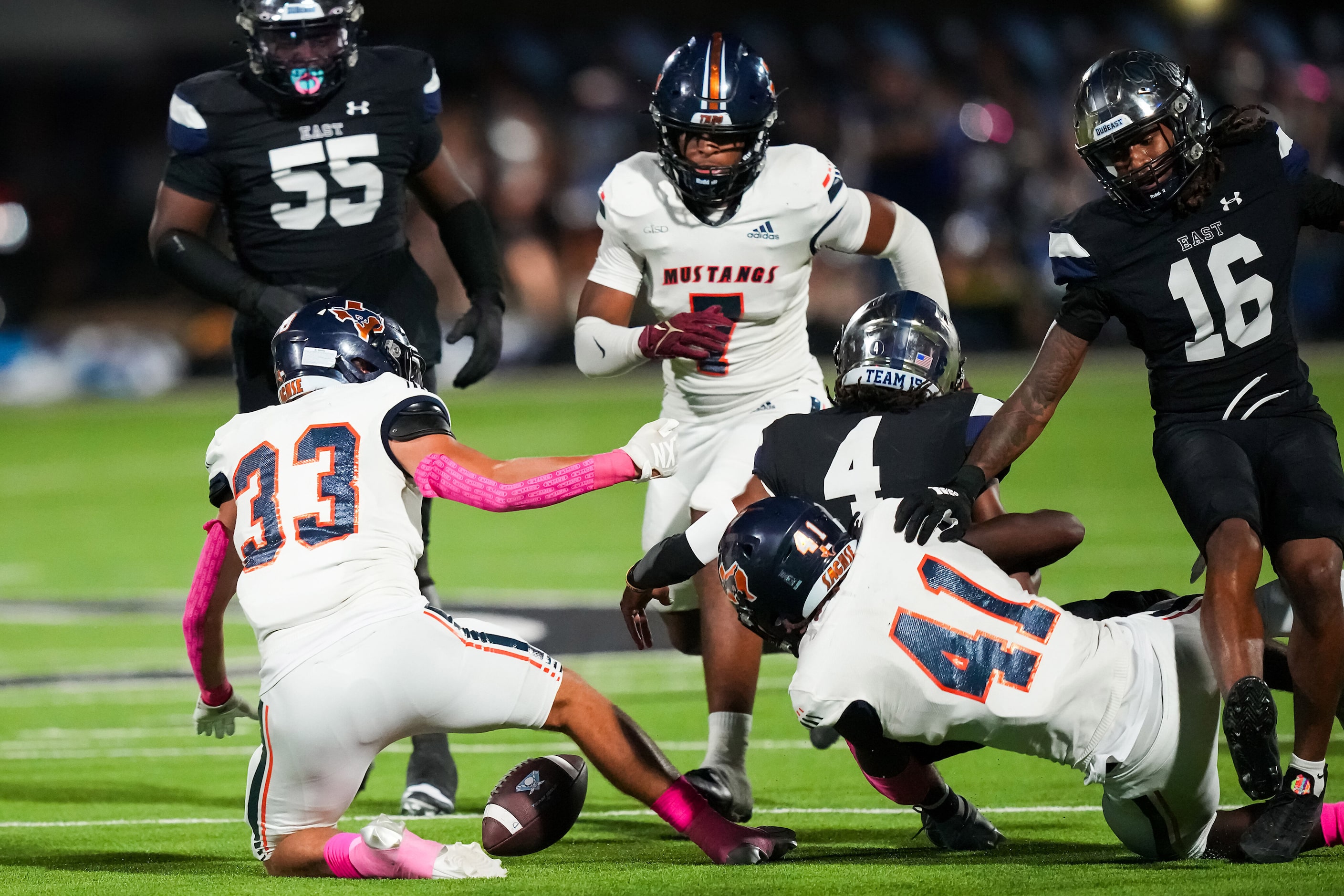 Wylie East quarterback Howard Fisher IV (4) fumbles as he is brought down by Sachse...