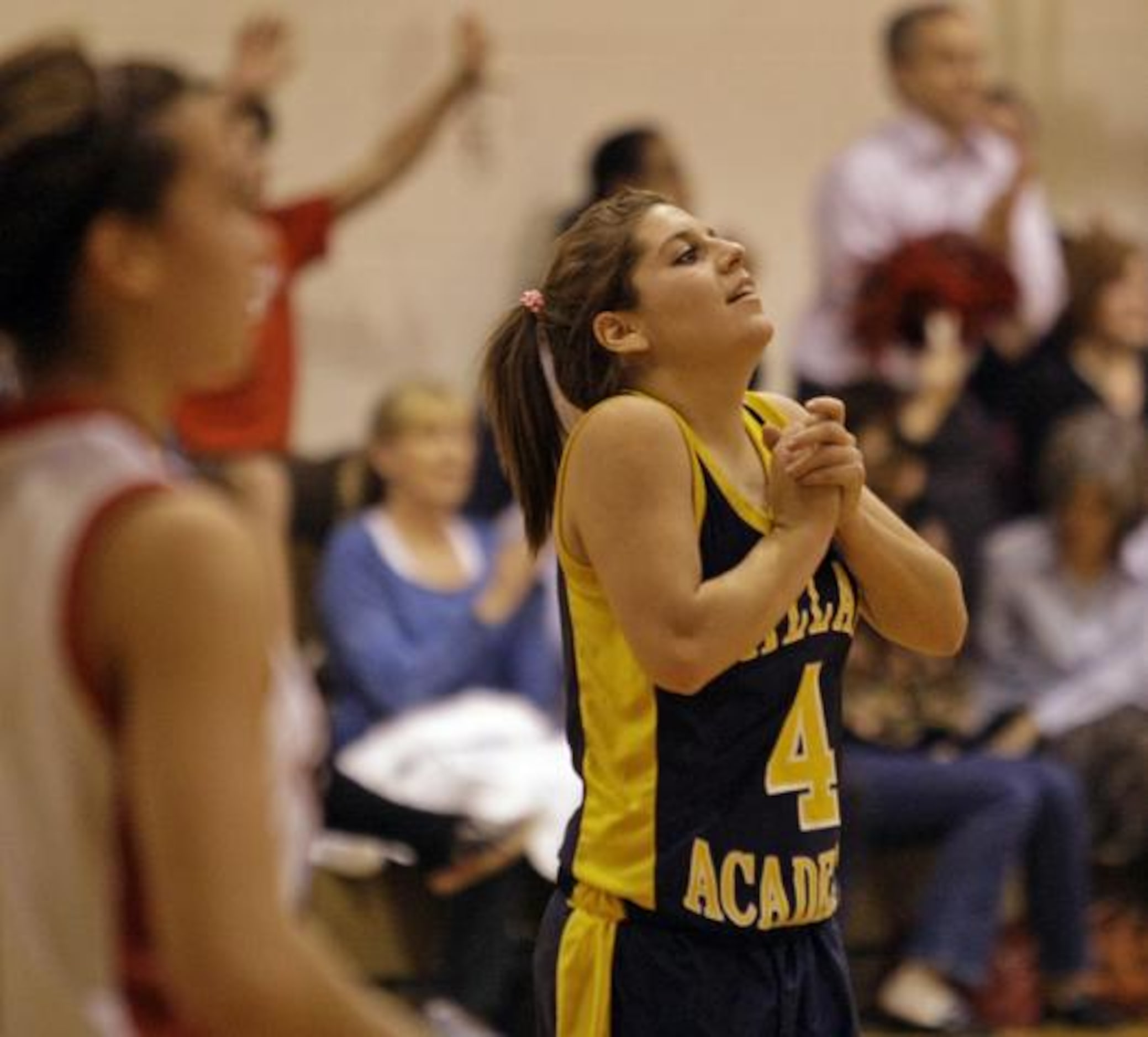 Dallas Academy senior guard Lesley Longoria reacts after the final buzzer ending her team's...