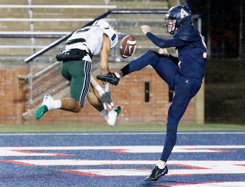 Prosper High School Adam Due (6) blocks the punt attempt by Allen High School punter Dylan...