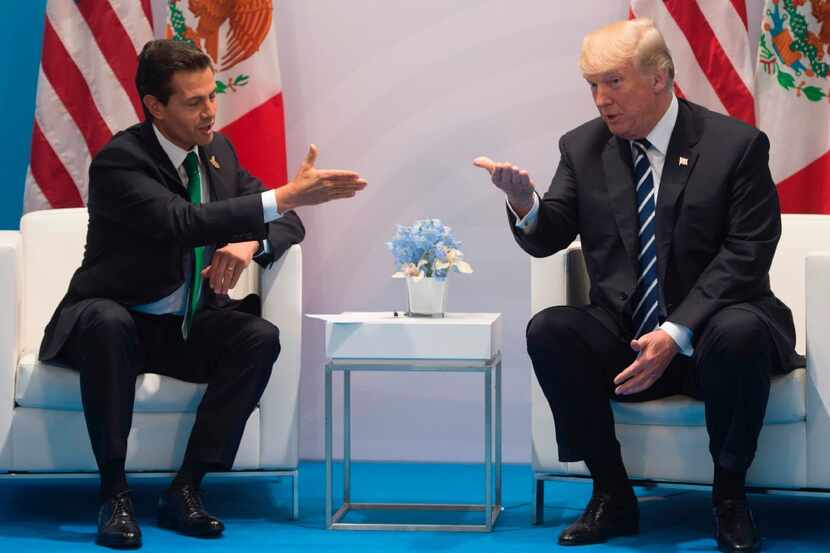 U.S.President Donald Trump and Mexican President Enrique Peña Nieto met at the G20 Summit in...