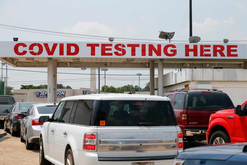 Dozens of people waited in line for COVID-19 testing in Dallas on Tuesday, Aug. 3, 2021.