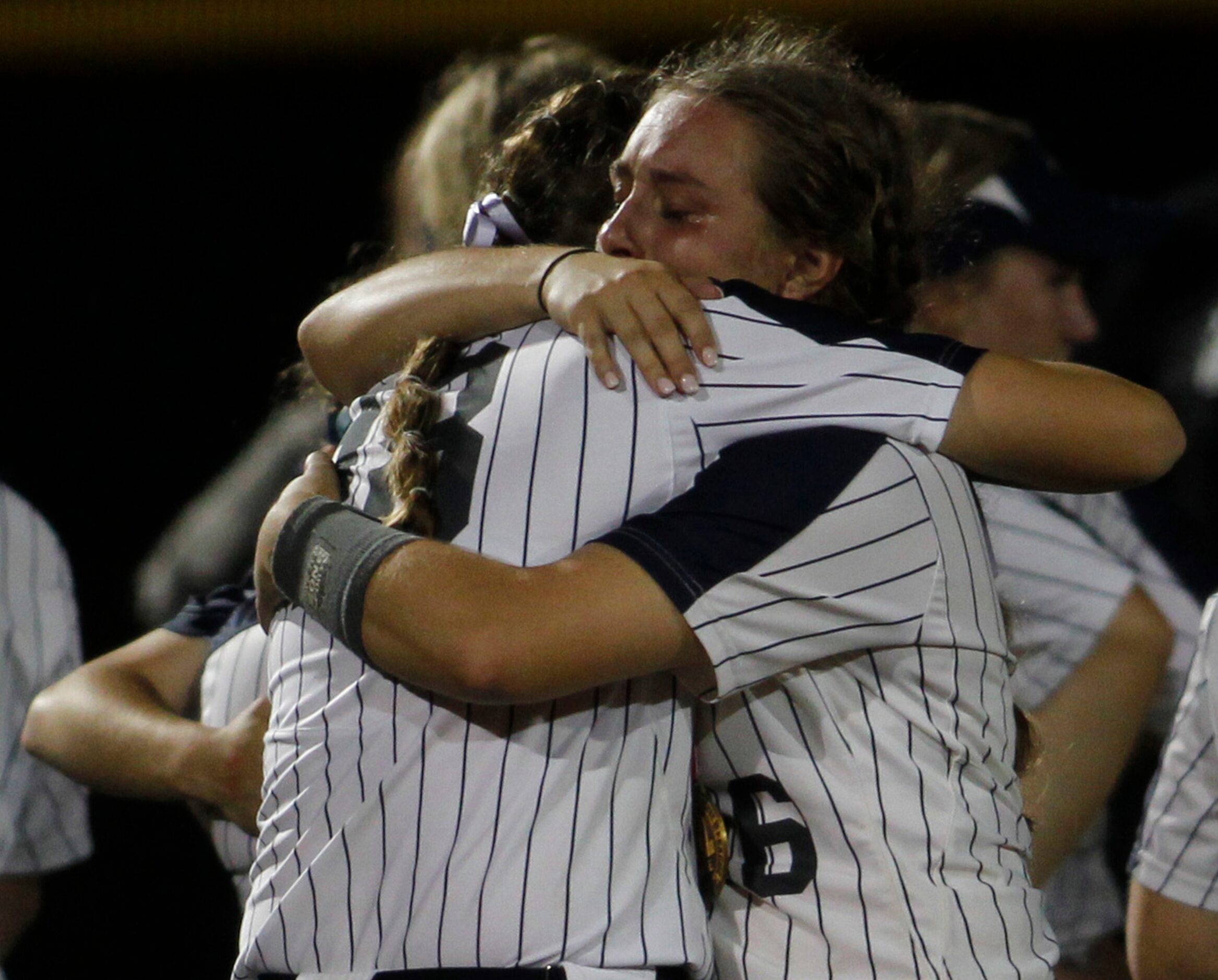 Flower Mound players console each other following their 2-0 loss to Deer Park. The two teams...