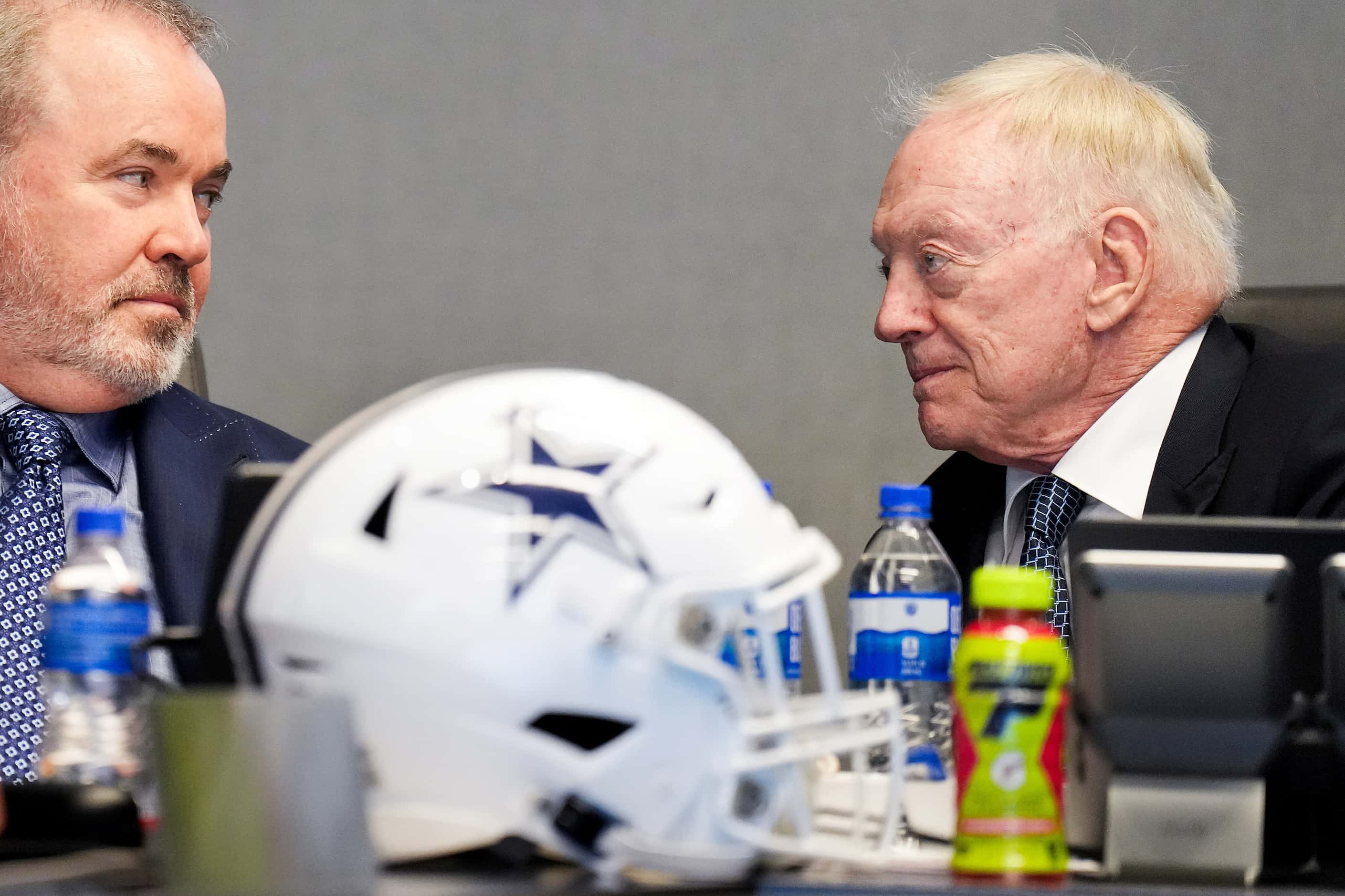 Dallas Cowboys owner and general manager Jerry Jones (right) talks with head coach Mike...