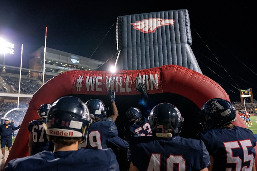 The Allen Eagles prepare to take the field before a bi-district round high school football...