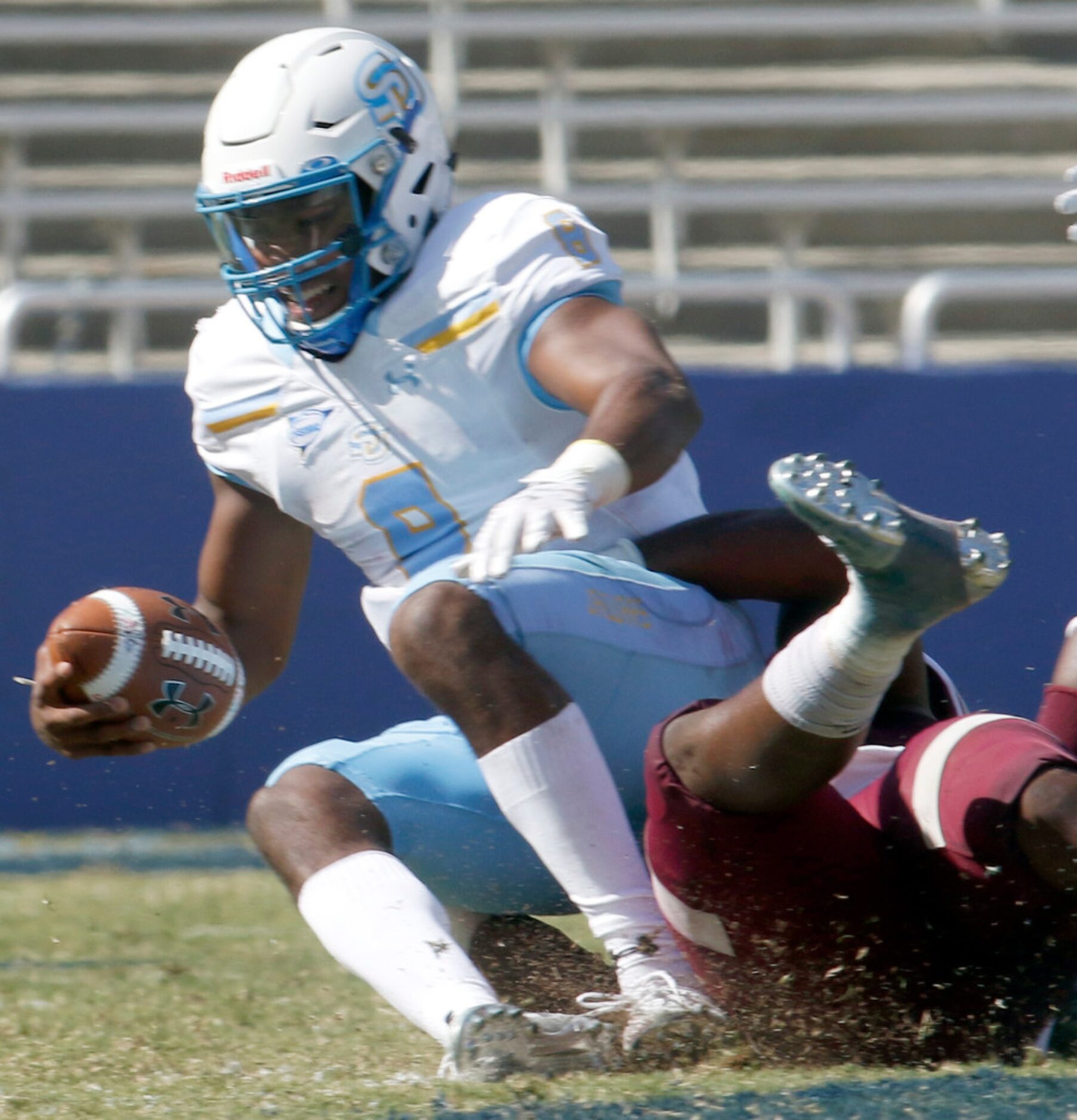 Southern quarterback Ladarius Skelton (8) is sacked by Texas Southern defensive end Michael...