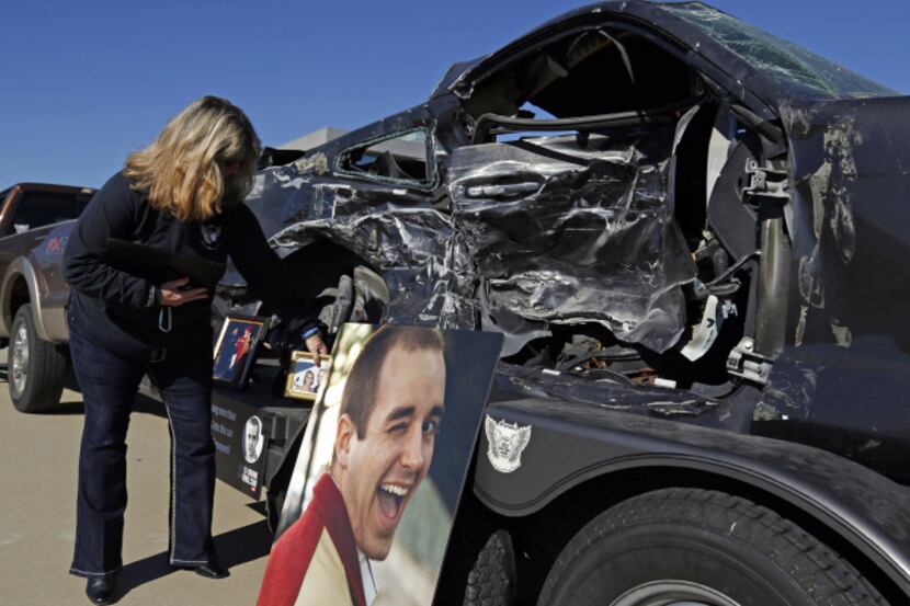 Kae Pennywell displayed pictures of her son during a joint DWI news conference Wednesday...