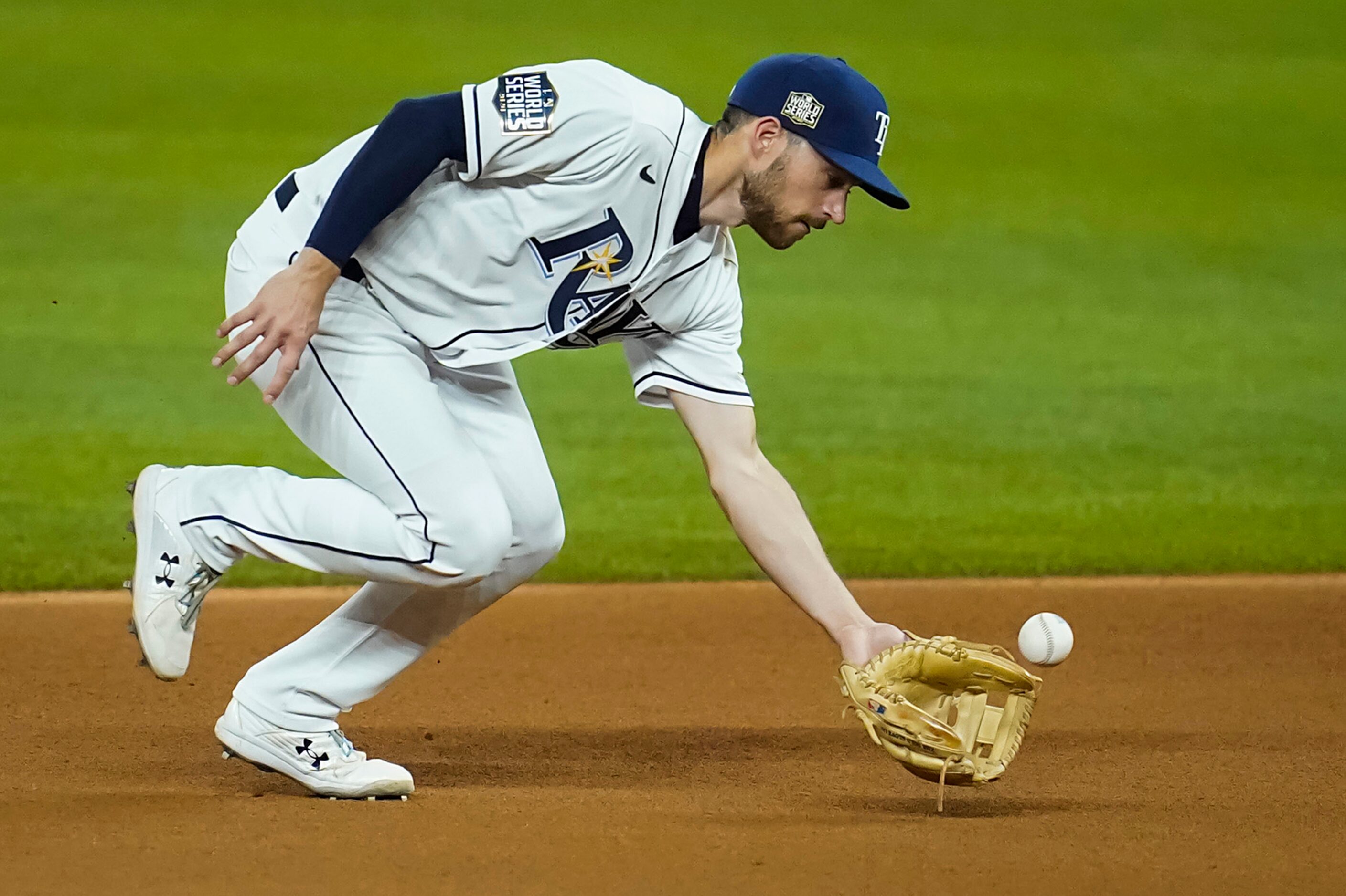 Tampa Bay Rays second baseman Brandon Lowe makes a catch on a line drive off the bat of Los...