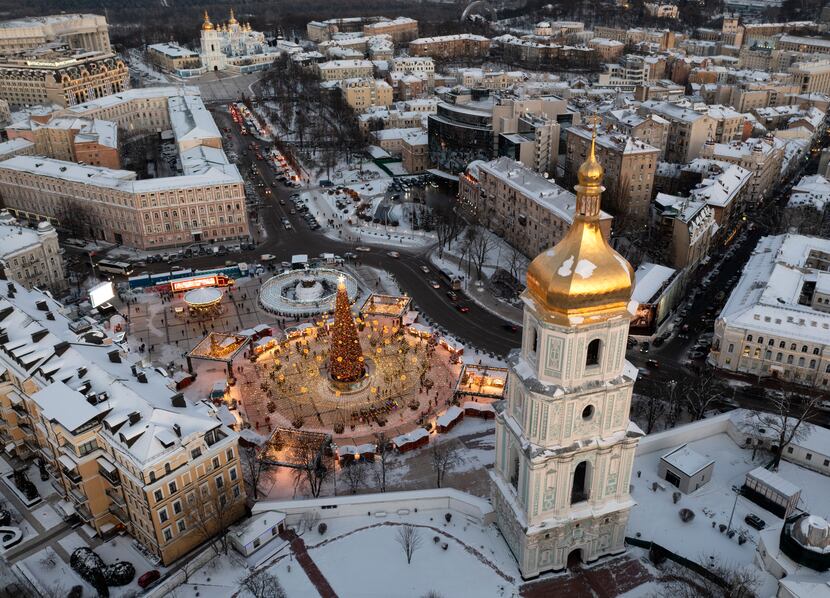 In this photo from December, snow covers the city center with a Christmas tree, St. Sophia...