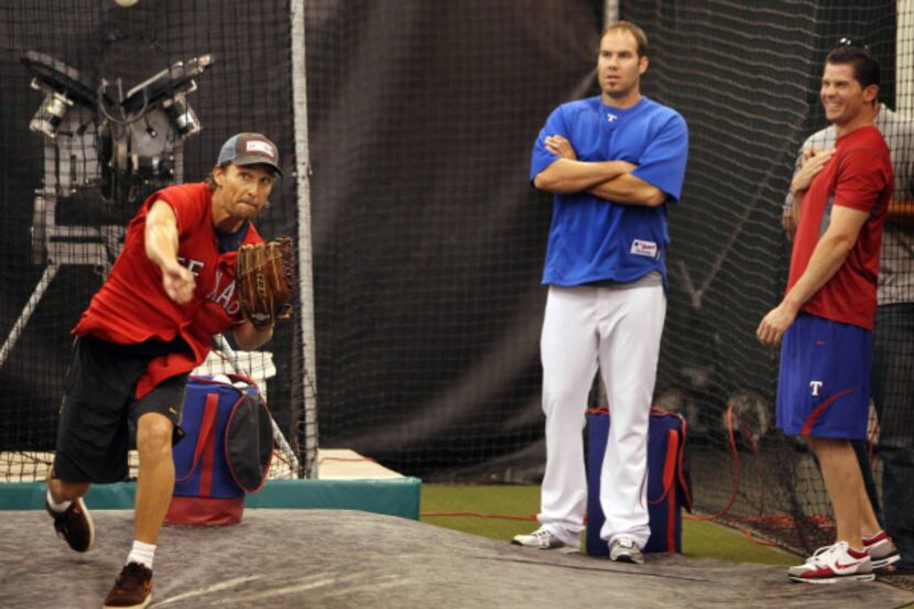 Actor Matthew McConaughey fired a pitch as Texas pitcher Colby Lewis and infielder Michael...