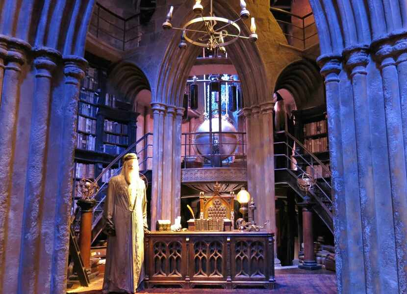 A robed statue of Dumbledore greets visitors in the head wizard's office, one of the...