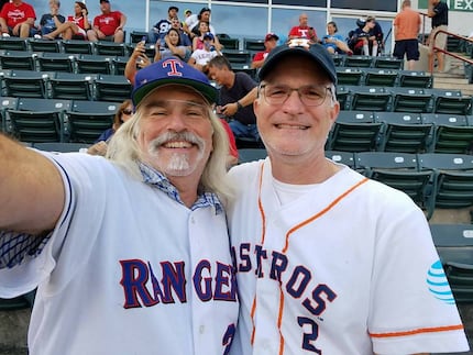 Dallas Morning News multiplatform editor Frank L. Christlieb (right) and Rangers fan friend...