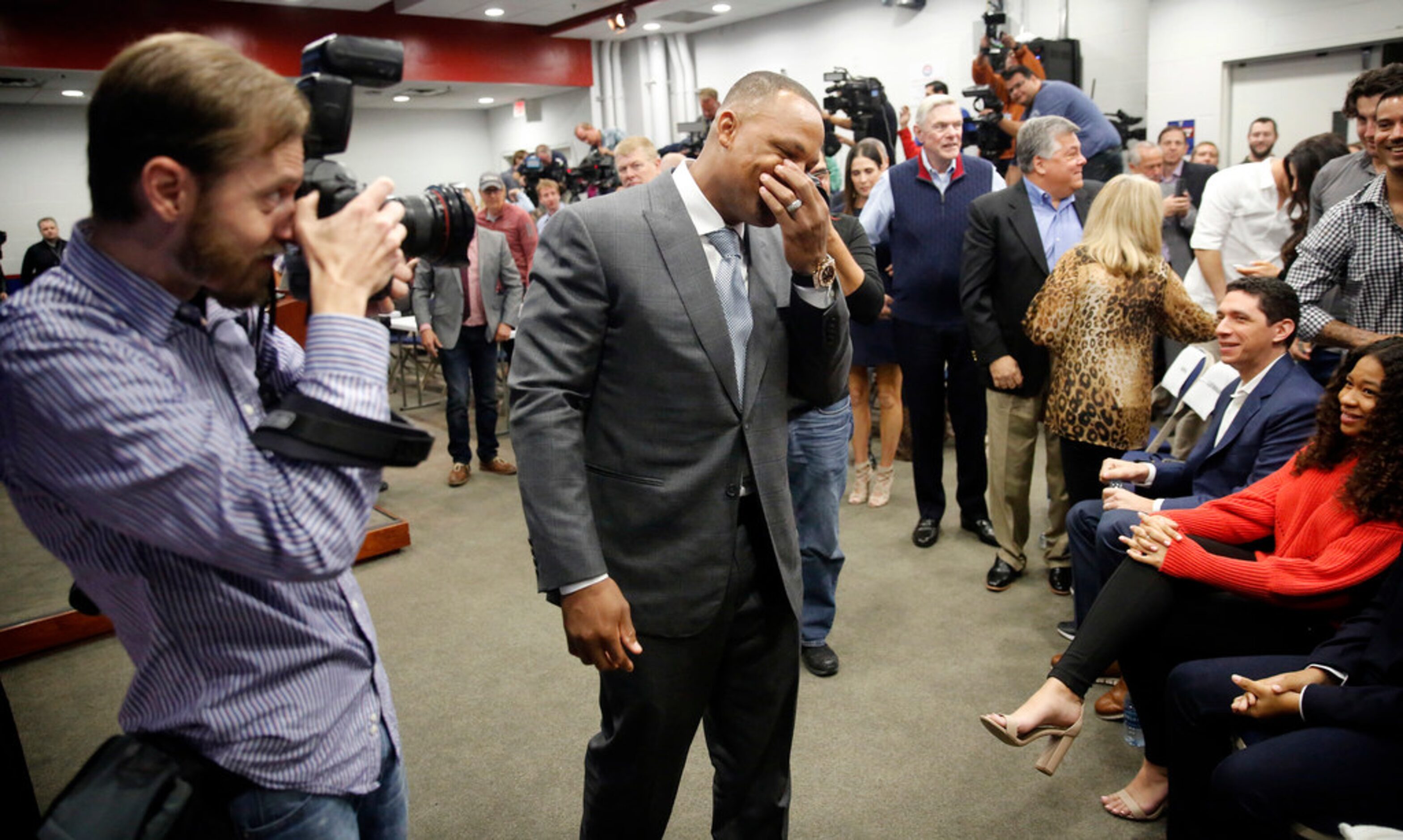 Former Texas Rangers third baseman Adrian Beltre fakes tears as he holds back from laughing...