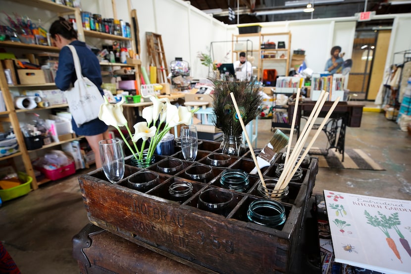 A shopper looks through a display of affordable arts and crafts supplies at Pegasus Creative...