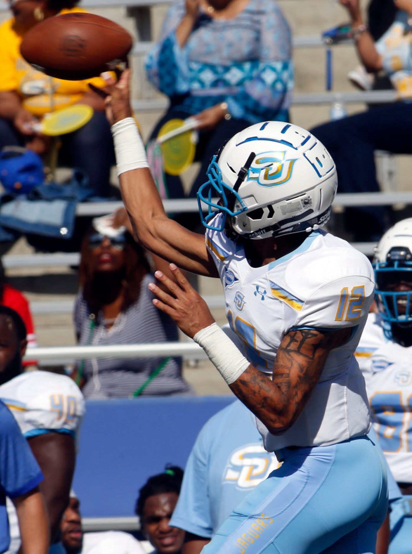 Southern quarterback Glendon McDaniel (12) completes a pass under  pressure from the Texas...