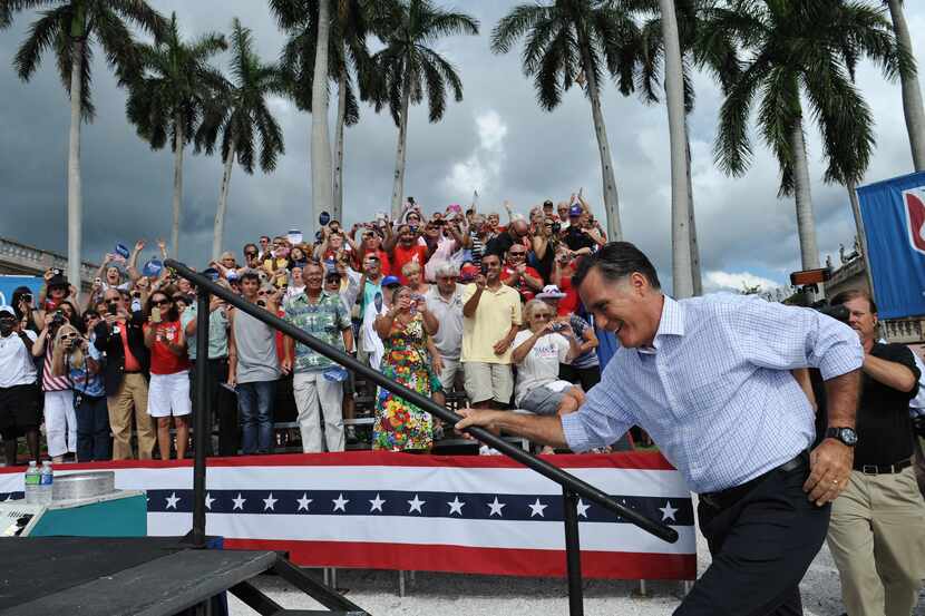US Republican presidential candidate Mitt Romney arrives at a campaign rally at the Ringling...