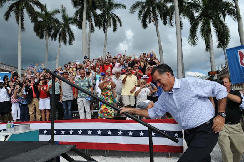 US Republican presidential candidate Mitt Romney arrives at a campaign rally at the Ringling...