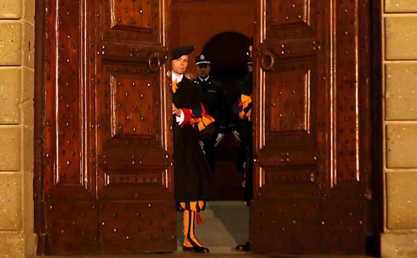 Vatican Swiss guards close the main door of the papal residence in Castel Gandolfo, south of...