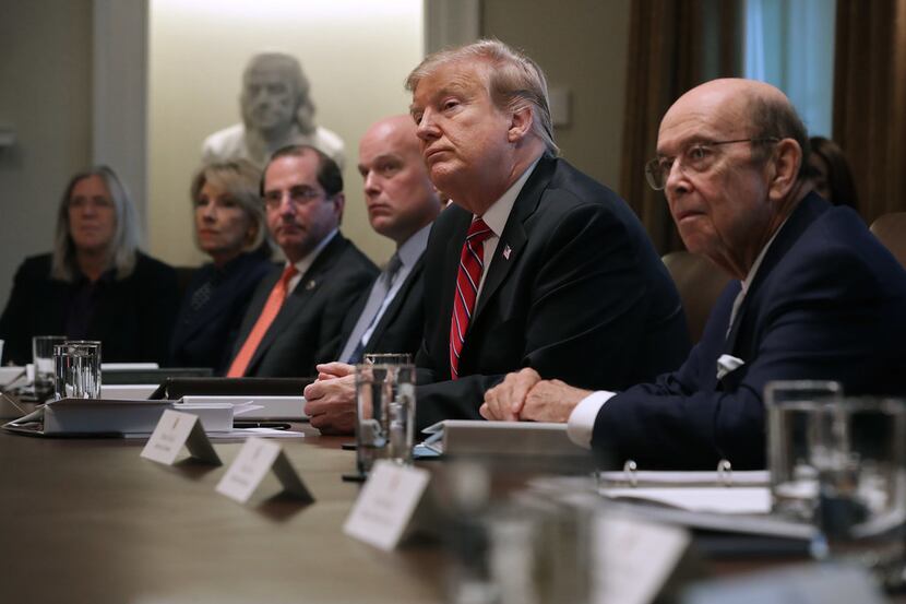 President Donald Trump talks to reporters during a Feb. 12 meeting with members of his...