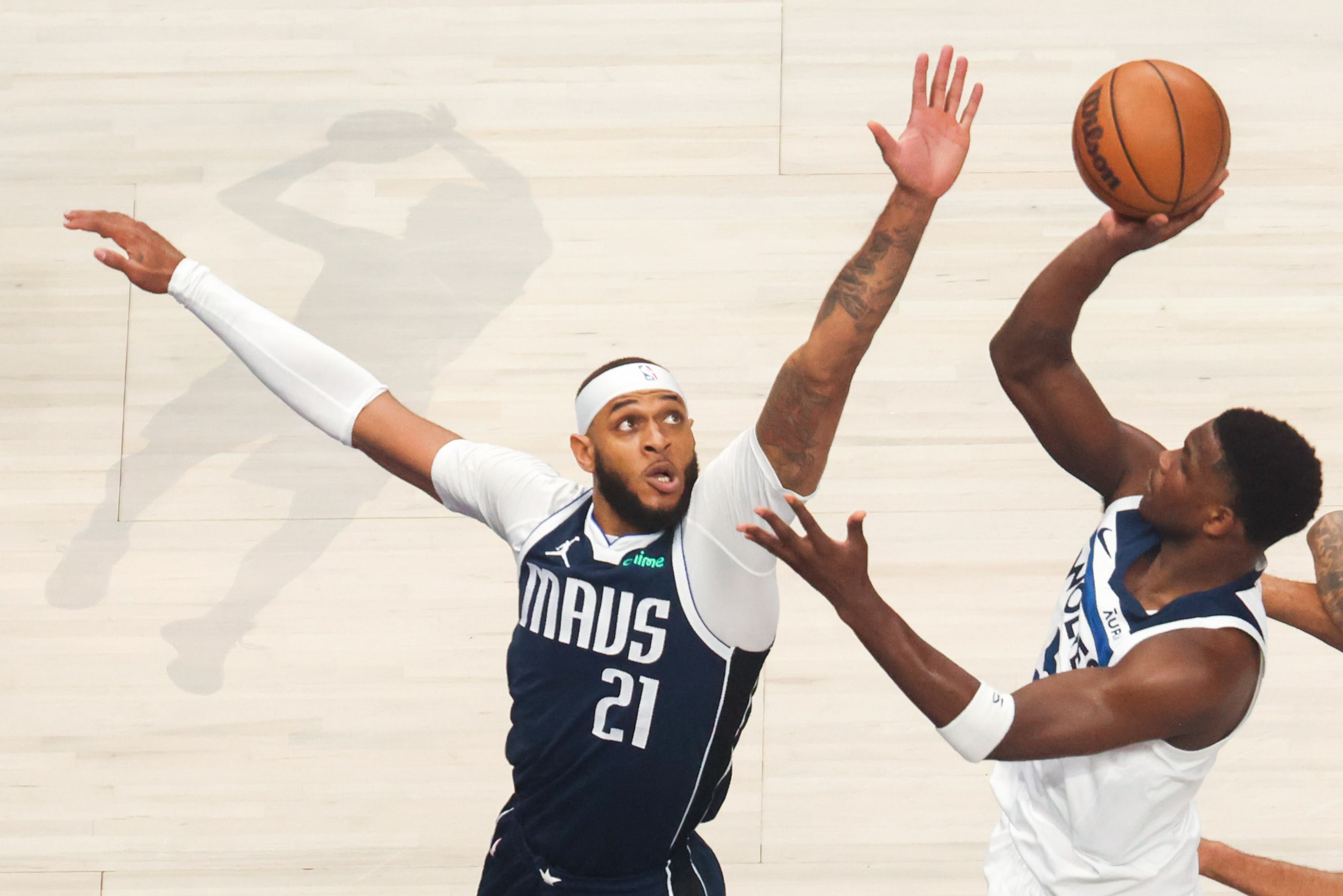 Minnesota Timberwolves guard Anthony Edwards shoots over Dallas Mavericks center Daniel...