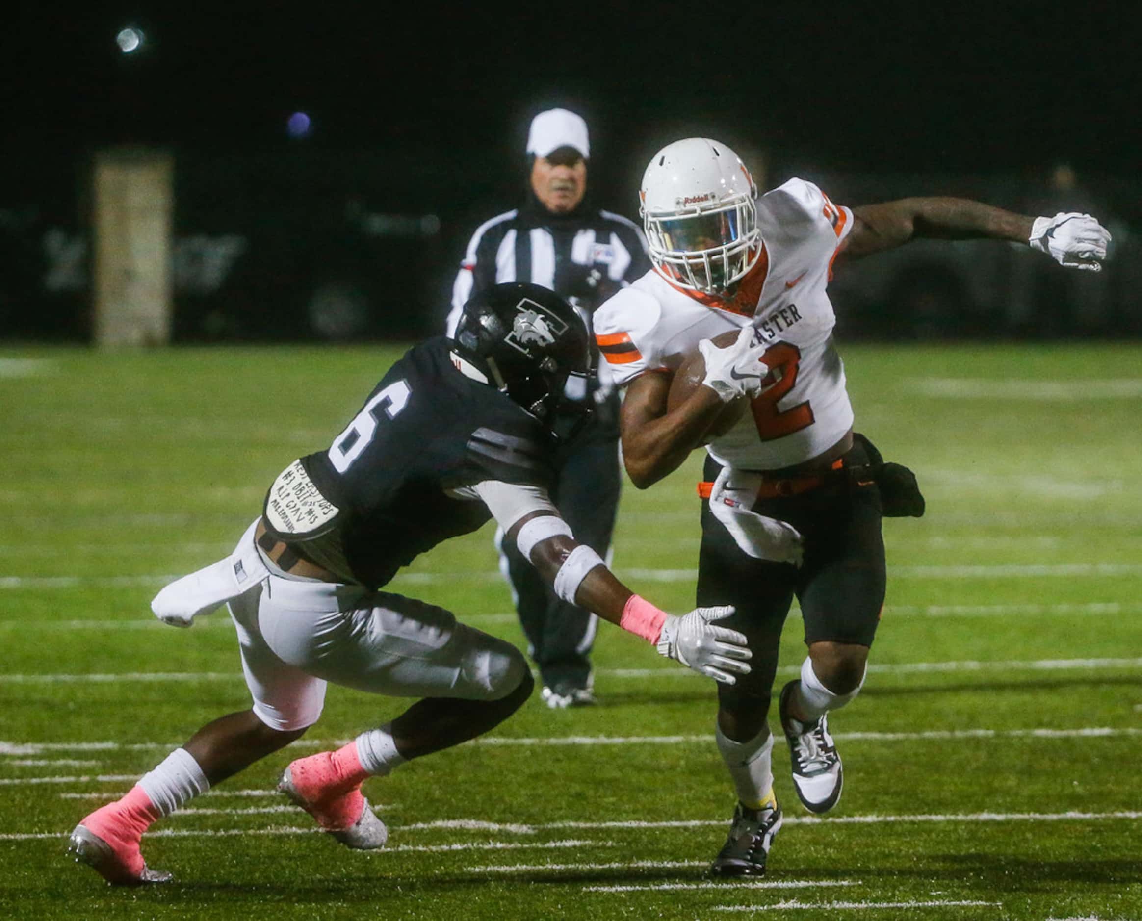 Lancaster running back Tre Bradford (2) makes a break away from Mansfield Timberview...