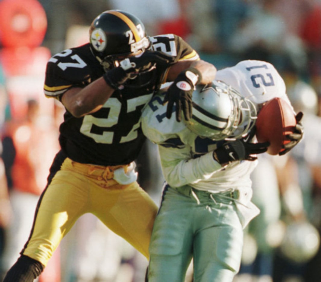 Deion Sanders pulls in a pass from Troy Aikman to the Steelers 14 yard line as Pittsburgh's...