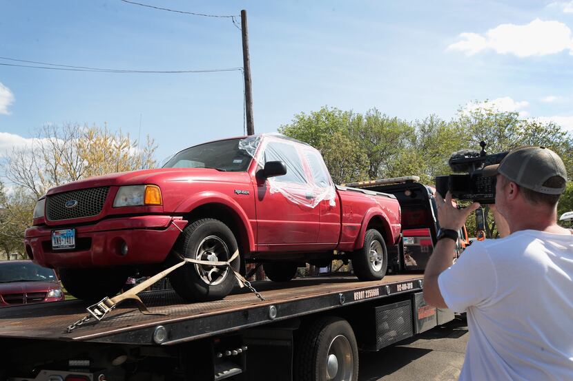  A vehicle is towed from the front of the home of Mark Anthony Conditt on March 22, 2018 in...
