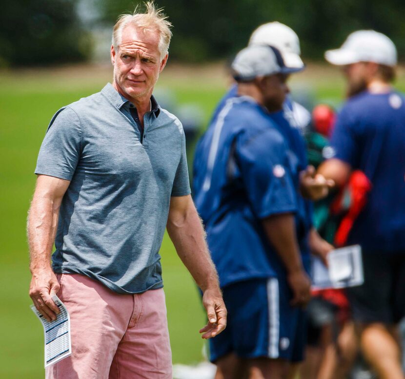 Former Dallas Cowboys player Daryl "Moose" Johnston watches from the sidelines during the...