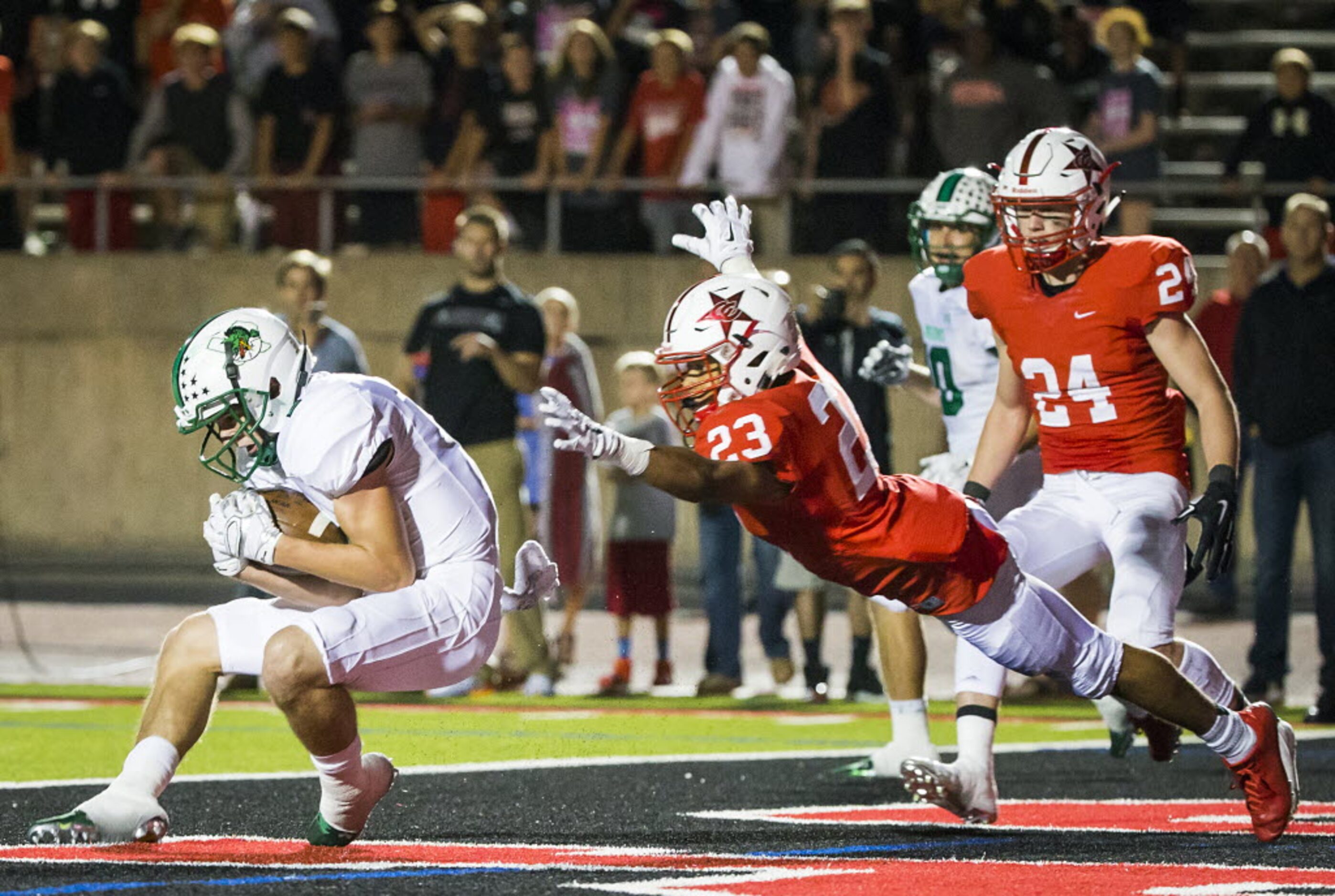 Southlake Carroll wide receiver Kam Duhon (2) catches a touchdown pass in overtime to make...